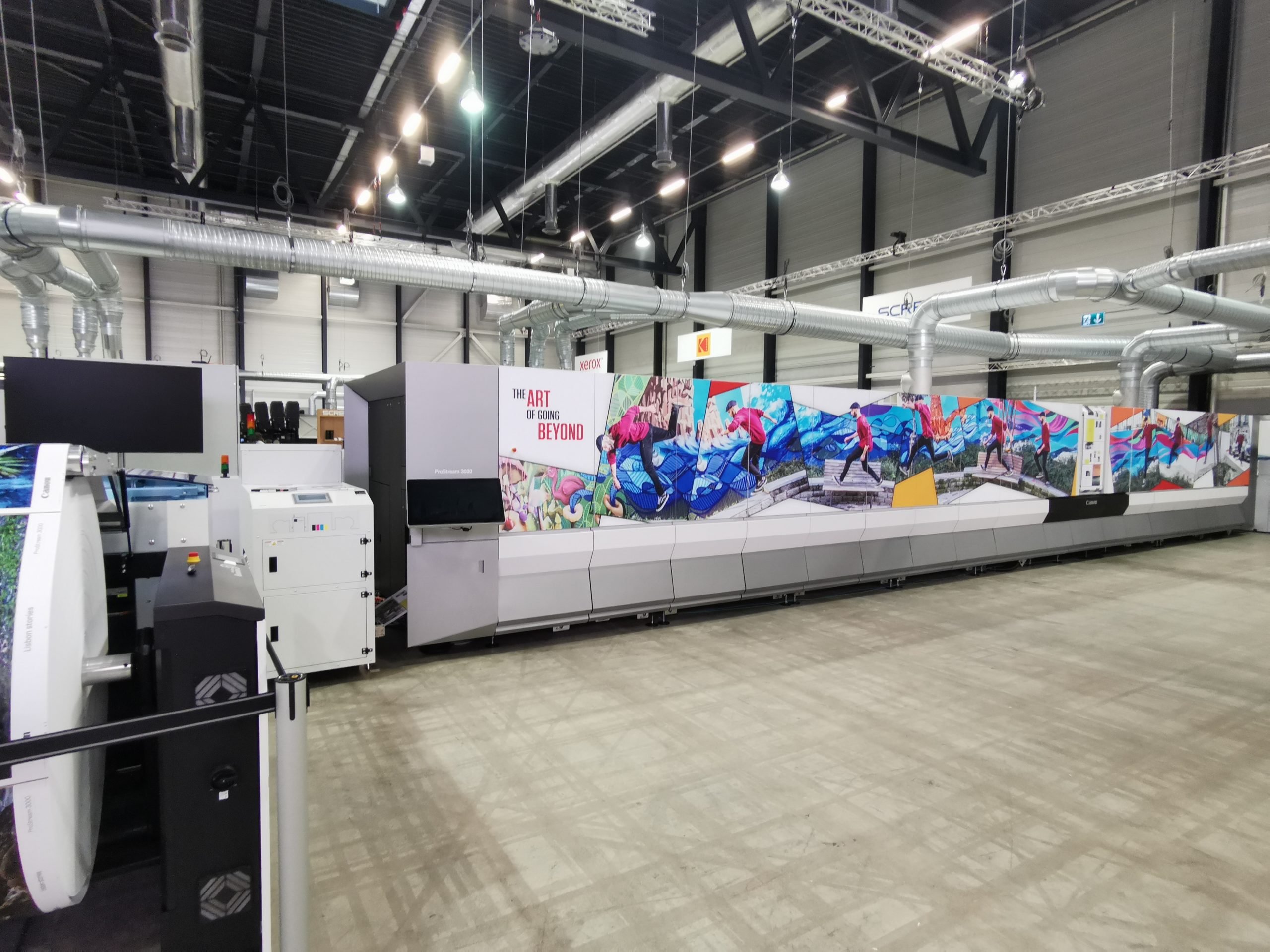 Image of the Canon Prostream at Hunkeler Innovationdays featuring the text "the art of going beyond"